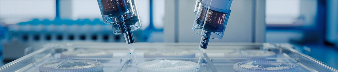 Two robotic arms precisely dispensing liquid into multiple circular samples in a clear, high-tech laboratory setting