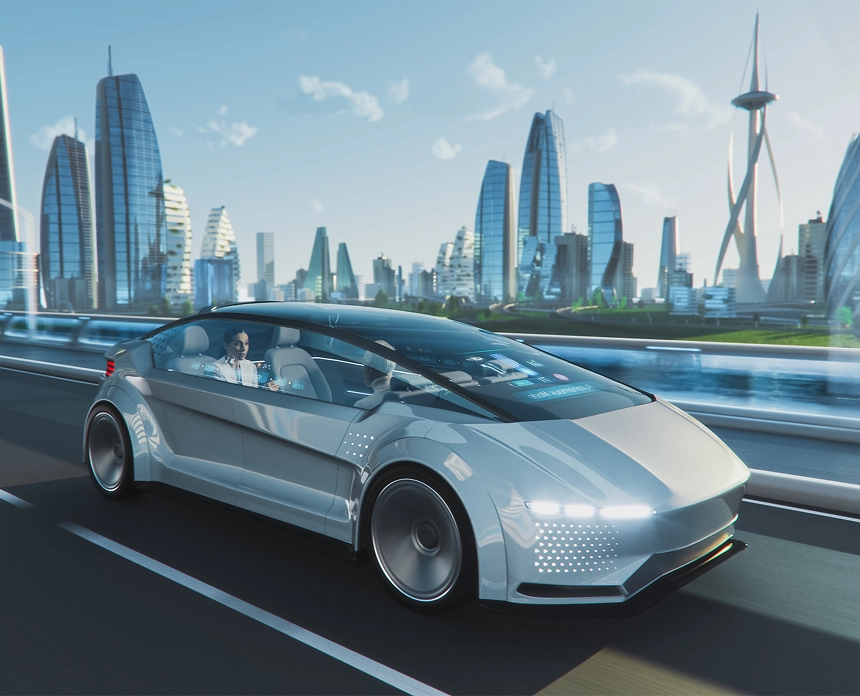 A sleek, silver autonomous electric car driving on a highway with a futuristic cityscape featuring modern glass skyscrapers in the background.